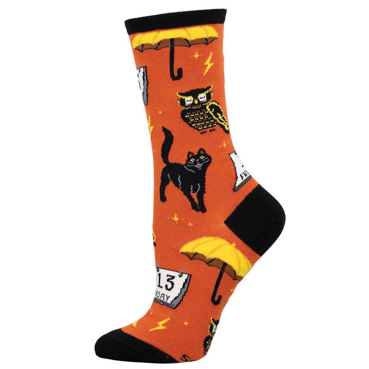 A pair of orange socks with black trim featuring a black cat, an owl, stars, and a calendar with the date October 31st, indicating a Halloween theme.