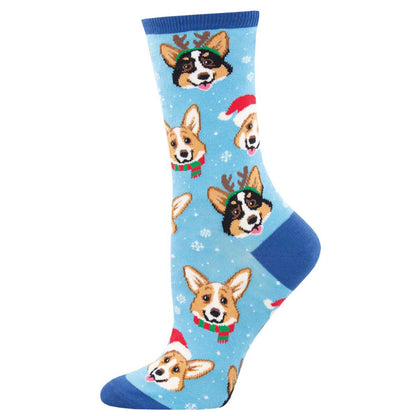 A pair of icy blue crew socks with a pattern of corgi dogs wearing Christmas hats.