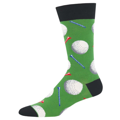 A pair of men's crew socks with a golf-themed pattern, featuring images of golf balls and tee markers on a green background with black heel, toe, and cuffs.