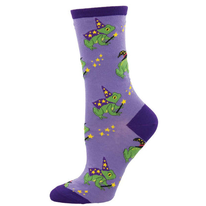 A pair of purple novelty cotton crew socks featuring a pattern with cartoon frogs wearing wizard hats and magical motifs.