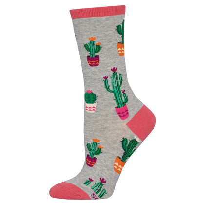 A pair of crew socks with a pattern of cactus plants in various pots on a heather gray background with pink trim.