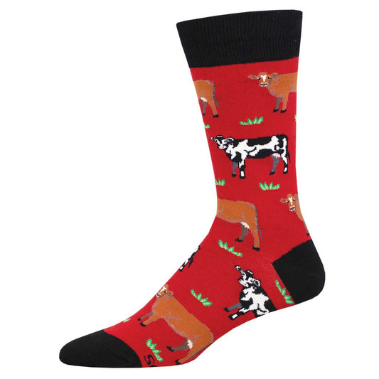 A pair of red crew socks with a pattern of various cows in different poses.