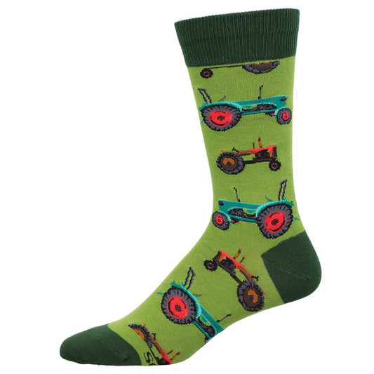 A pair of green crew socks with a pattern of red and green tractors.