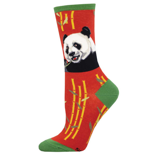 A pair of women's crew socks with a red orange background featuring a panda and bamboo accents.