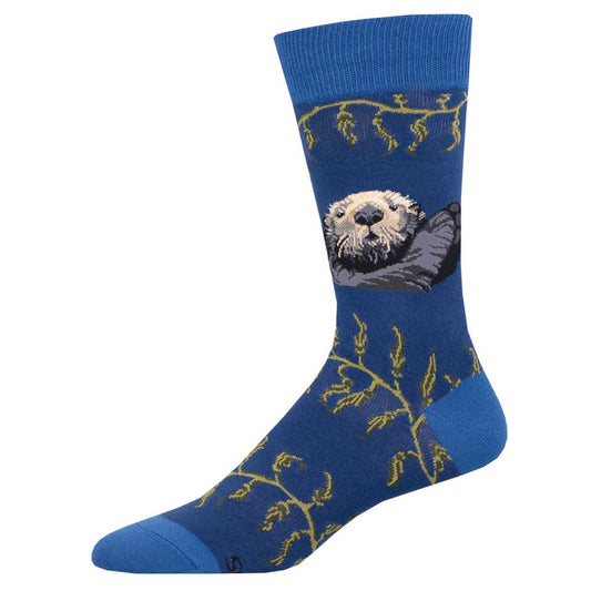 A pair of blue cotton crew socks with a sea otter design and green seaweed accents.