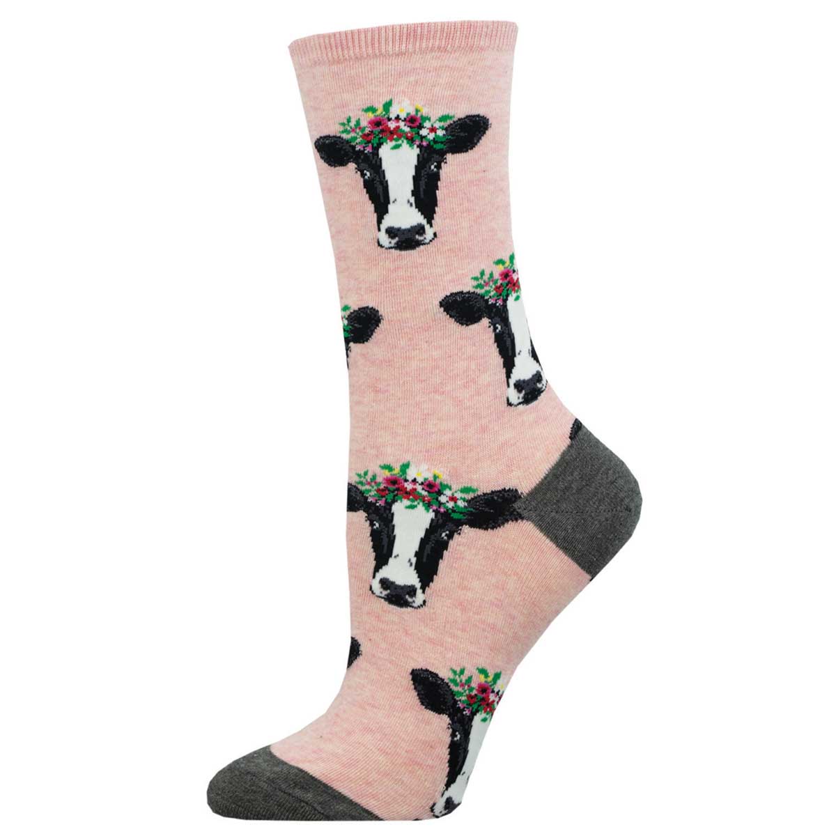 A pair of heather pink crew socks with a pattern of cow heads wearing flower crowns.