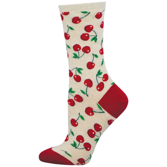 A pair of women's crew socks with a cherry pattern and red heel and toe accents on an ivory background.