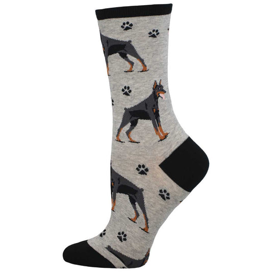 A pair of socks with a pattern featuring a Doberman dog and paw prints on a gray background.