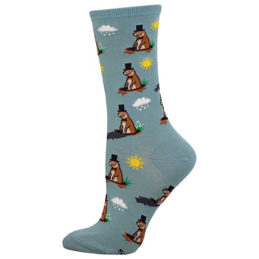 A pair of blue crew socks with a pattern featuring a groundhog wearing a hat and checking his shadow.