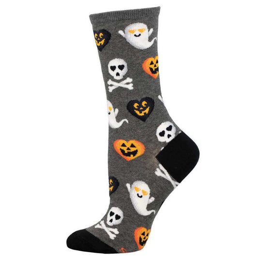 A pair of gray crew socks with a pattern of ghosts, pumpkins, and skulls.