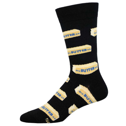 A pair of black crew socks with a pattern of sticks of butter, predominantly in yellow and white.